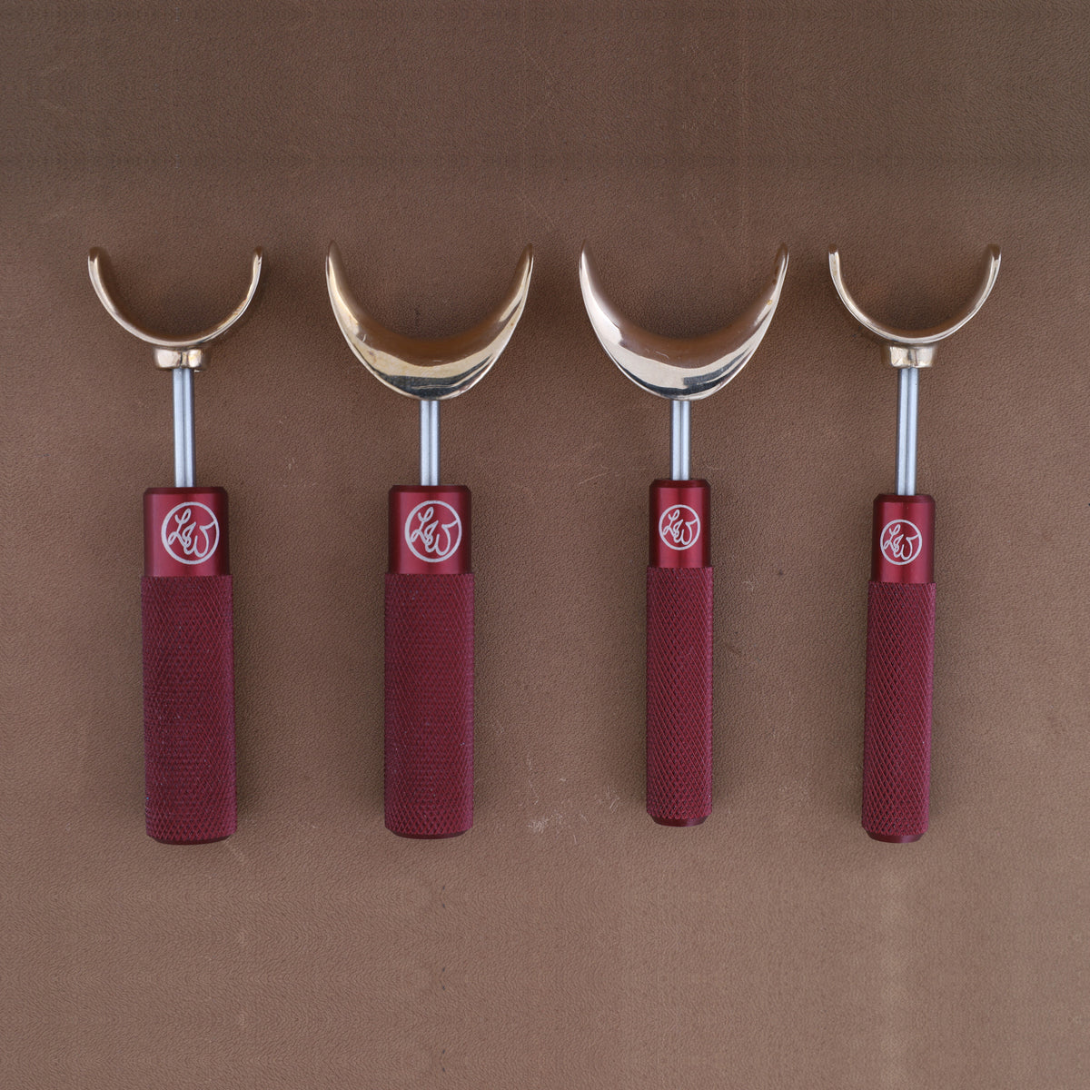 Leather Wranglers SK-3 swivel knives in Red, 3/8 and 1/2 inch barrels, flat and saddle yokes