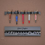 Swivel knives in the rack above a Leather Wranglers Tools Tray
